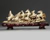 A Chinese carved ivory 'Eight Horses of Mu Wang' group