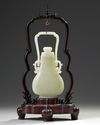 A CHINESE PALE JADE HANGING VASE WITH COVER AND HARDWOOD STAND