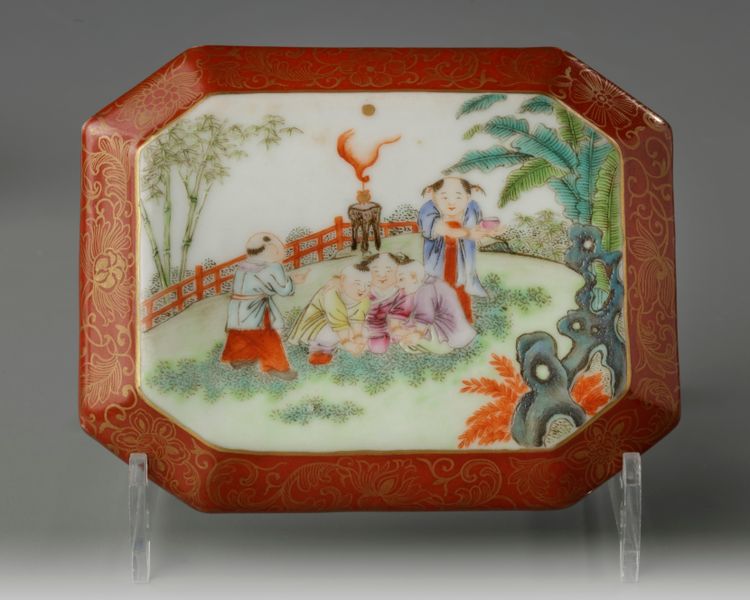 A Chinese coral-ground famille rose octagonal seal paste box and cover