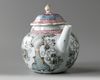 A Chinese famille rose moulded 'floral' teapot and cover