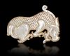 A YELLOW JADE TIGER PLAQUE, CHINA, ZHOU - EARLY HAN PERIOD (1046-150 BC)