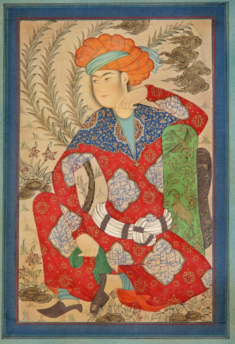 A COLORFUL PERSIAN SEATED YOUTH, 20TH CENTURY