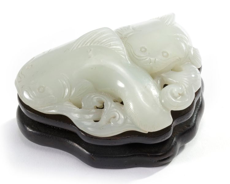 A Chinese pale celadon jade 'twin catfish' carving