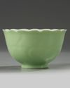 A Chinese pale-green glazed moulded 'floral' bowl