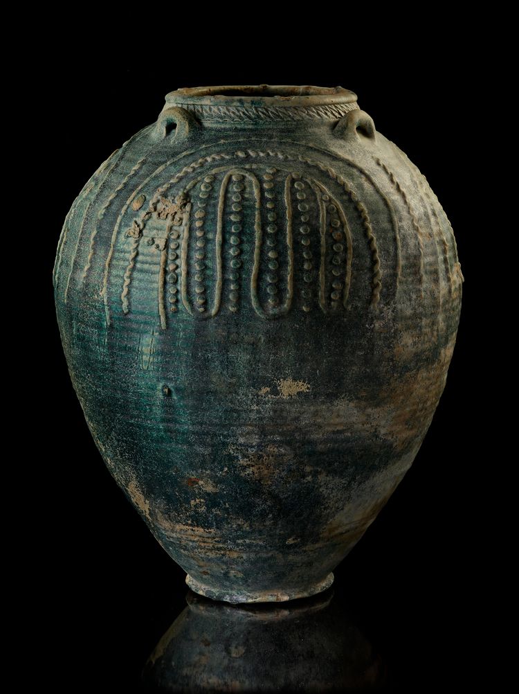 A POST SASSANIAN TURQUOISE GLAZED POTTERY STORAGE JAR, IRAN OR IRAQ, 7TH-8TH CENTURY