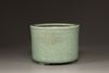 A Chinese celadon glazed tripod censer