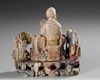 A CHINESE SOAPSTONE FIGURE OF A DAOIST IMMORTAL, 19TH CENTURY