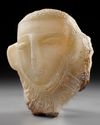 A CARVED ALABASTER FUNERARY PORTRAIT WITH INSCRIPTION TO THE NECK, LATE 1ST MILLENNIUM BC