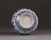 A small blue and white vase