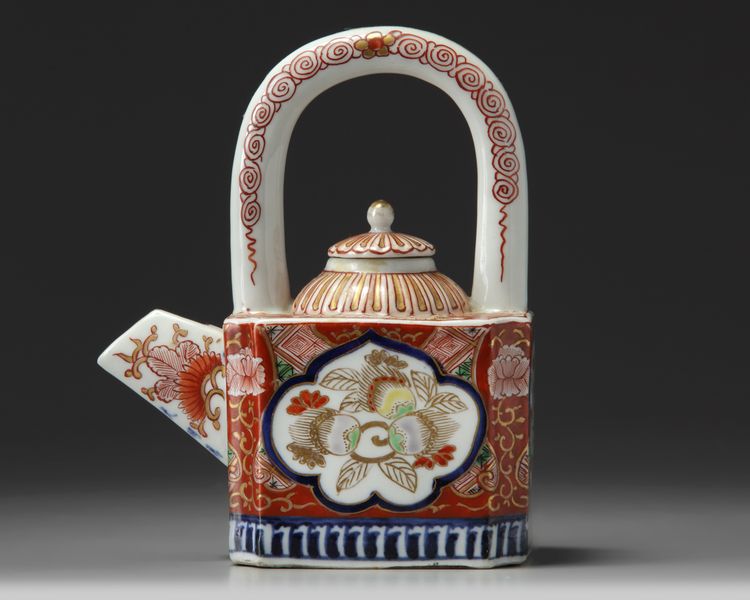 A JAPANESE IMARI-ARCH-HANDLES TEAPOT AND COVER, 19TH CENTURY