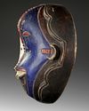 AN AFRICAN MASK, 20TH CENTURY