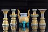 A Chinese yellow-ground famille rose altar set