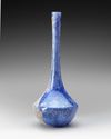 A TALL-NECKED BLUE GLASS BOTTLE PERSIA OR SYRIA, 11TH–12TH CENTURY