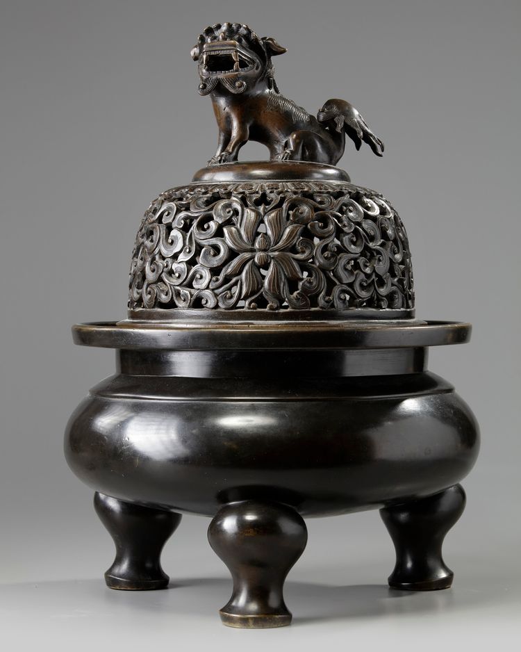 A large Chinese bronze tripod censer