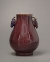 A Chinese flambé-glazed deer-handled vase. Hu