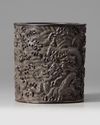 A Chinese zitan ‘dragon and waves’ brush pot, bitong