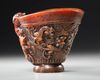A CHINESE CARVED BUFFALO HORN LIBATION CUP, 19TH CENTURY
