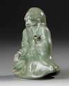 A CHINESE CELADON FIGURE CENSER,  MING DYNASTY, 15TH CENTURY