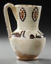 A FINE SLIP-PAINTED POTTERY MUG, PERSIA, 9TH-10TH CENTURY