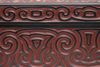A  Japanese lacquerwork box, its lid and sides decorated with carved arabesques