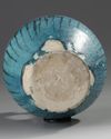 A LARGE RAQQA UNDERGLAZE PAINTED POTTERY EWER, SYRIA, 12TH-13TH CENTURY