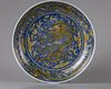 A blue-ground yellow enamelled 'dragon' dish