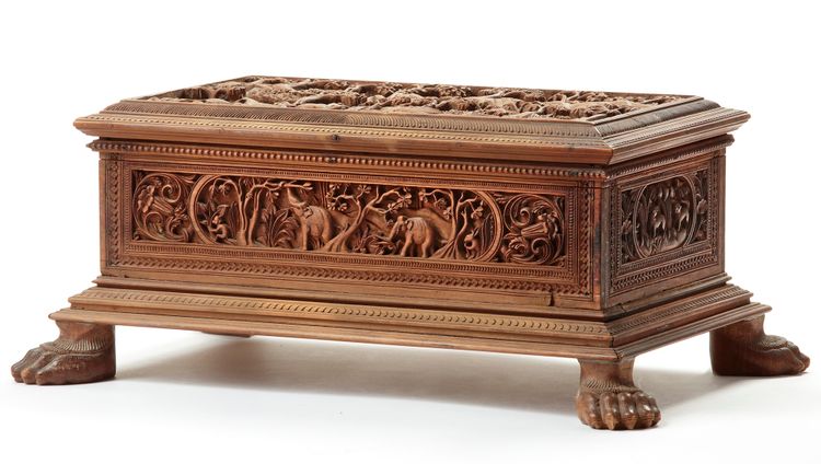 A DEEPLY CARVED SANDALWOOD CHEST WITH HUNTING SCENES