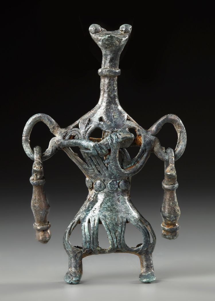 A WESTERN ASIATIC AMLASH OPENWORK BRONZE IDOL, CIRCA 1ST MILLENIUM B.C.