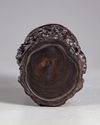 A Chinese wooden brush pot