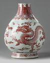 A Chinese underglaze copper-red and blue decorated 'dragon' vase