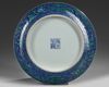 A Chinese blue ground green-enamelled 'dragon' charger