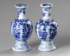 A PAIR OF BLUE AND WHITE ‘FLOWER AND FOLIAGE’ VASES, KANGXI PERIOD
