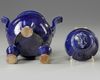 A Chinese blue-glazed tripod censer and cover