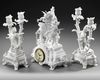 A FRENCH SEVRES BISCUIT CLOCK SET, 19TH CENTURY