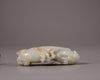 A Chinese white and russet jade 'Three Abundances' carving