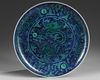 A Chinese blue ground green-enamelled 'dragon' charger