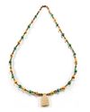 A MIXED TRADE BEAD NECKLACE WITH CARVED PENDANT