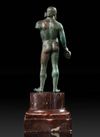 A GRECO ROMAN BRONZE STATUETTE OF HERAKLES, CIRCA 1ST CENTURY B.C. / A.D.