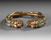 A SINO TIBETAN GILDED BANGLE, 19TH CENTURY
