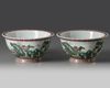A pair of Chinese famille rose jardinieres and stands