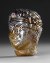 A ROMAN GLASS HEAD VESSEL CIRCA 1ST–3RD CENTURY A.D.