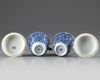 A pair of Chinese blue and white twin-handled chocolate cups and covers