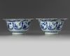 A pair of Chinese blue and white ‘floral’ klapmuts bowls
