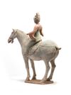 A Chinese painted pottery equestrian
