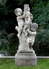 A CARVED STATUE OF PUTTI'S, LATE 19TH CENTURY ON A LATER BASE