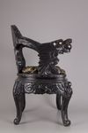 A pair of Chinese hardwood dragon chairs