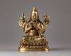 A Sino-Tibetan gilt bronze figure of a Lama