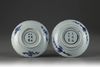A near pair of blue and white dishes