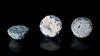 * THREE COBALT-BLUE, GREEN AND TURQUOISE GLASS GAMES PIECES, MESOPOTAMIAN REGION, 8TH-9TH CENTURY