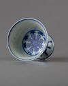 A blue and white 'lanca character' stem cup